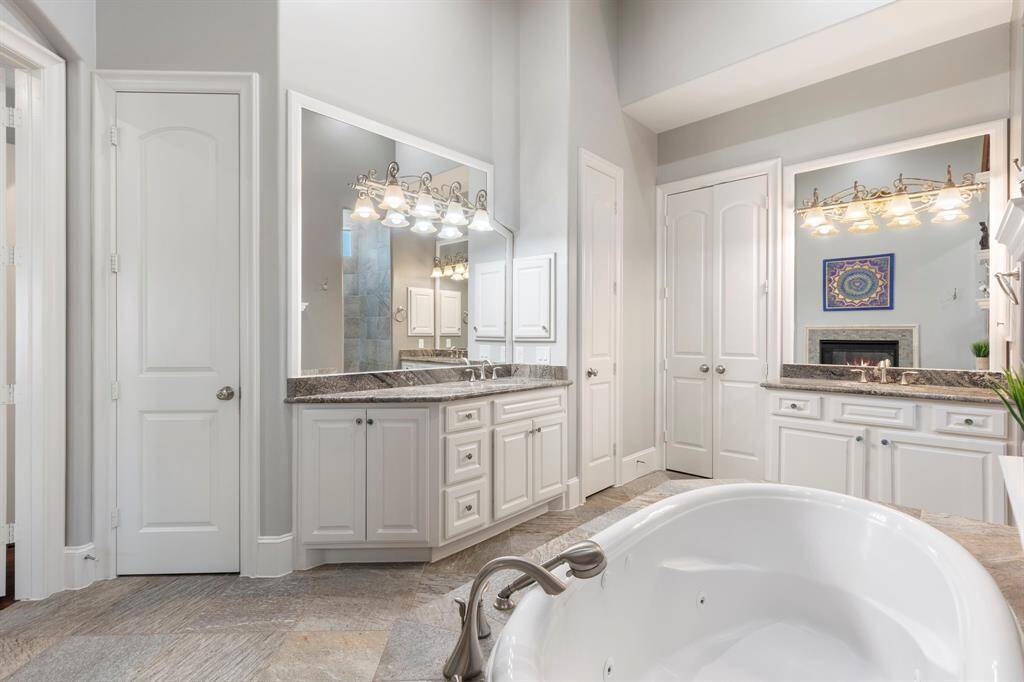 Double sinks, linen closet and large walk-in closet.