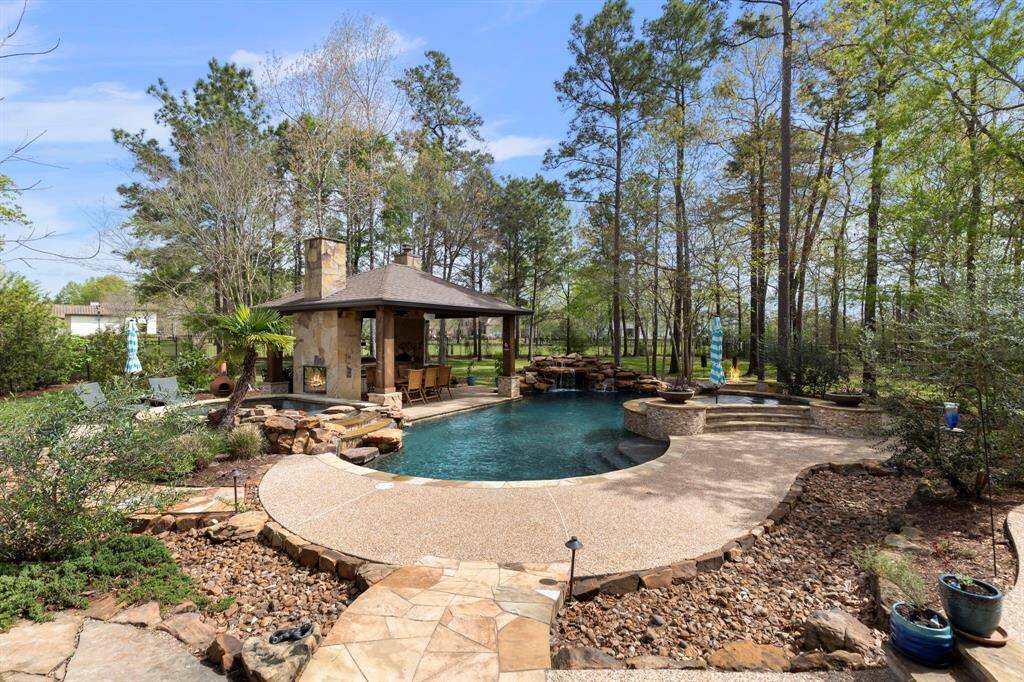 Absolutely stunning outdoor space!  Gazebo with fireplace, outdoor kitchen, fire pit and plenty of entertaining space.