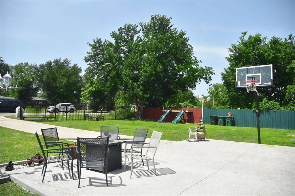 Front view of the home features expansive concrete patio.