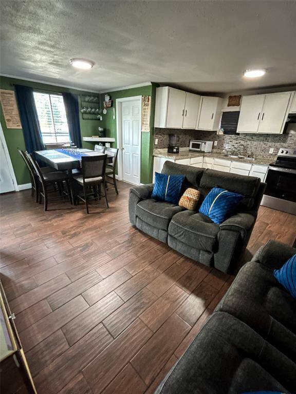 Spacious great room view showing living and dining areas.