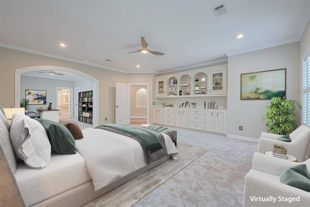 Large primary bedroom with reading area.