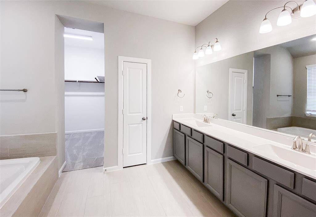 Primary bath has double vanities