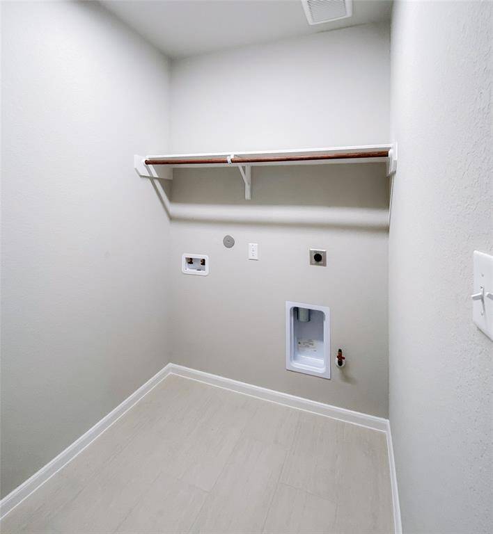 In-house utility room with washer and dryer connections