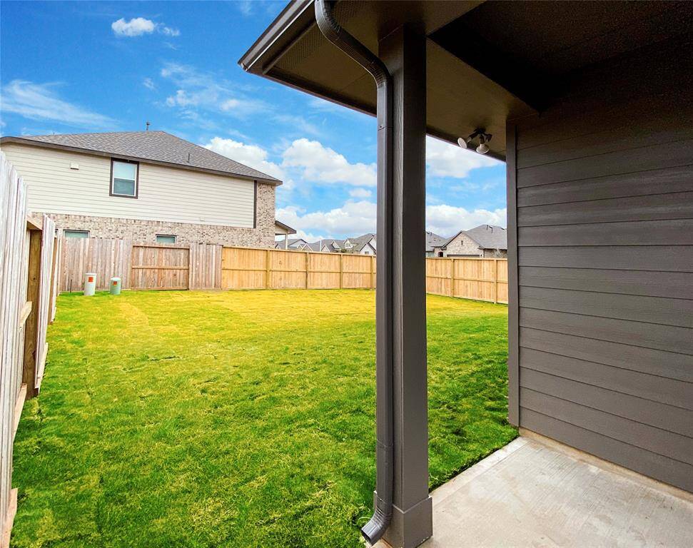 House is equipped with full gutters and the patio with floodlights