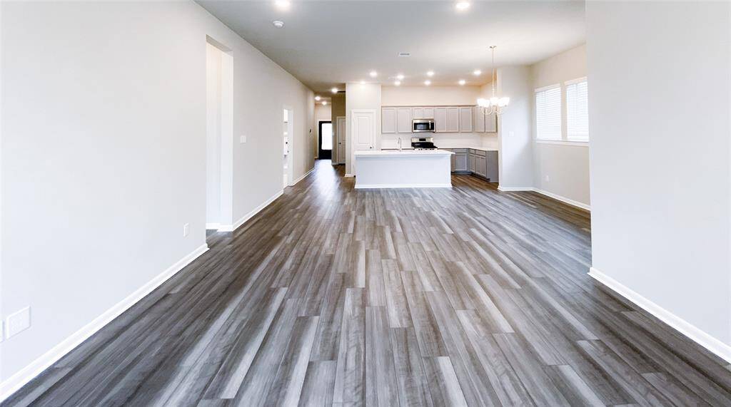 Another look at the sunlit kitchen, dining and family room