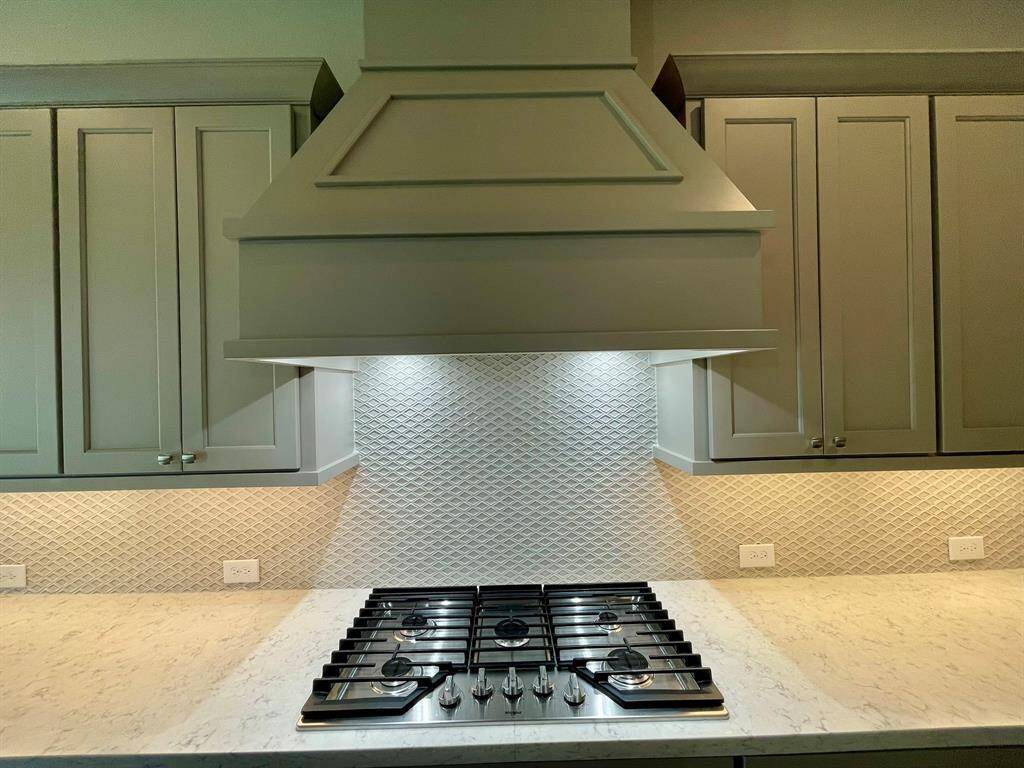 Ample vent hood to aid while Cooking here.