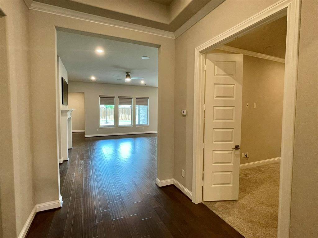Behind the solid French Doors is a game/media/flex room that is wired for sound.