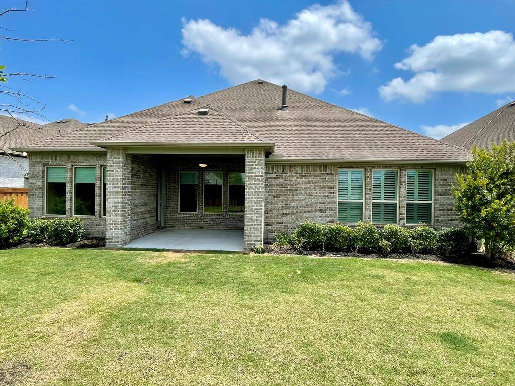Nestled on a Greenbelt Lot with a Partial Water View.