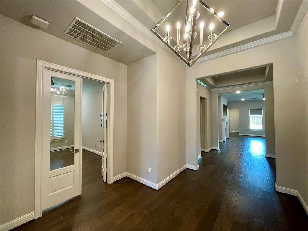 Back to the main Hallway and the Glass French Doors which lead to your Study / Home Office.