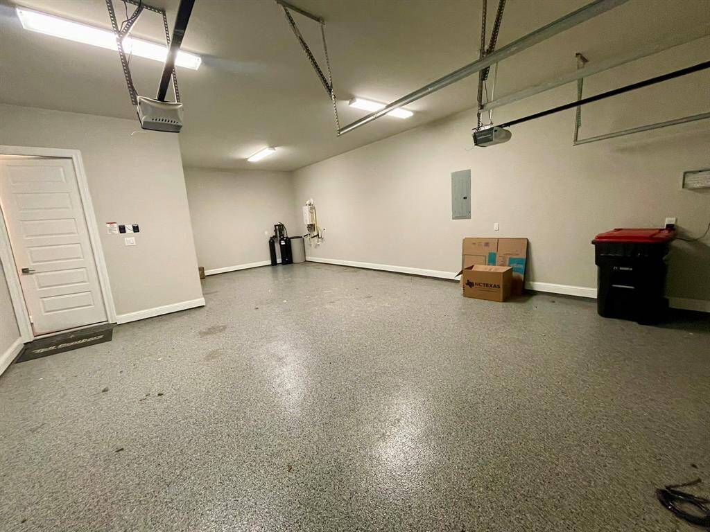 Epoxy Floor in this 3 Car Tandem Garage.  Full Sprinkler System for the Yard.  Rain Bird Control box found here too.