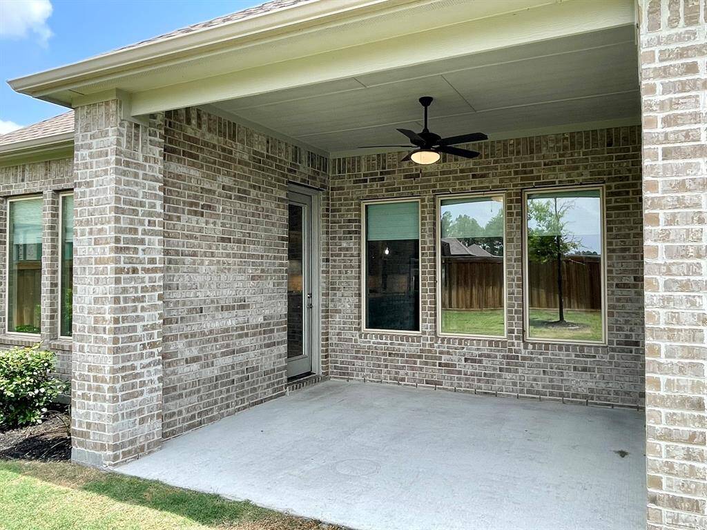 Wall of Windows across the back of the home from the Dining, Family Room and Primary Suite.