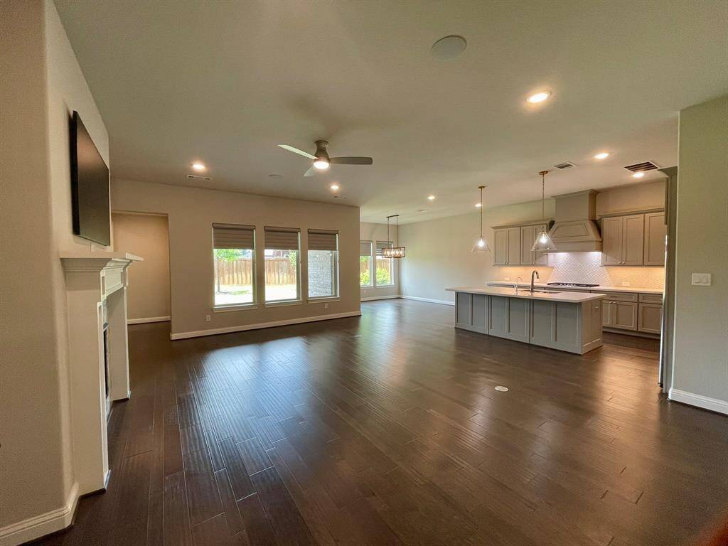 Oversized Family Room with adjacent Kitchen and dedicated Dining Room.