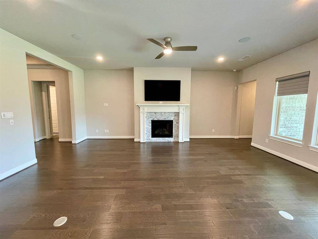 Great space includes smart frame TV for your use.  Notice the Wood Flooring in all the Public Areas.