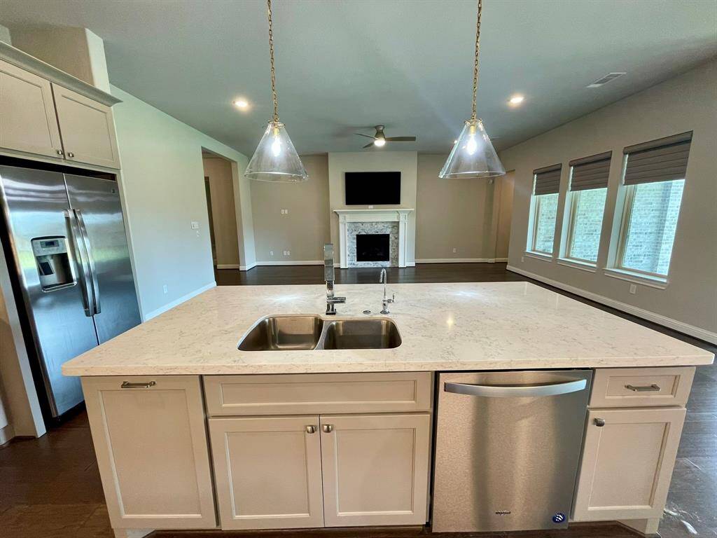 Stunning Quartz Countertops for this Gourmet Kitchen.  Refrigerator stays for your use.