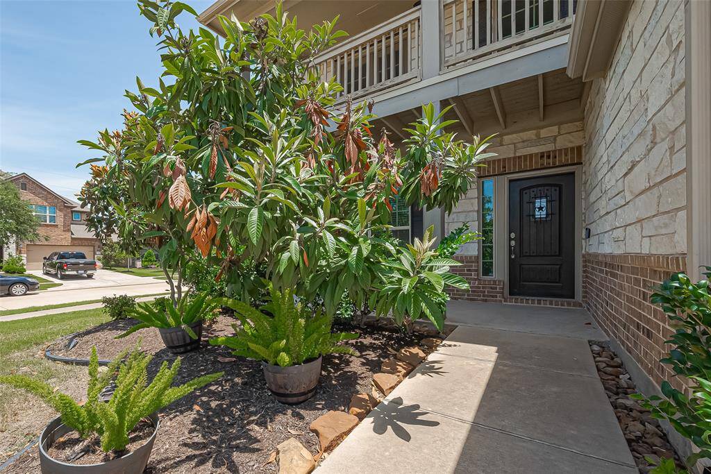 The exterior boasts a combination of brick and cement siding, complemented by a composition roof, all set on a well-maintained lot.