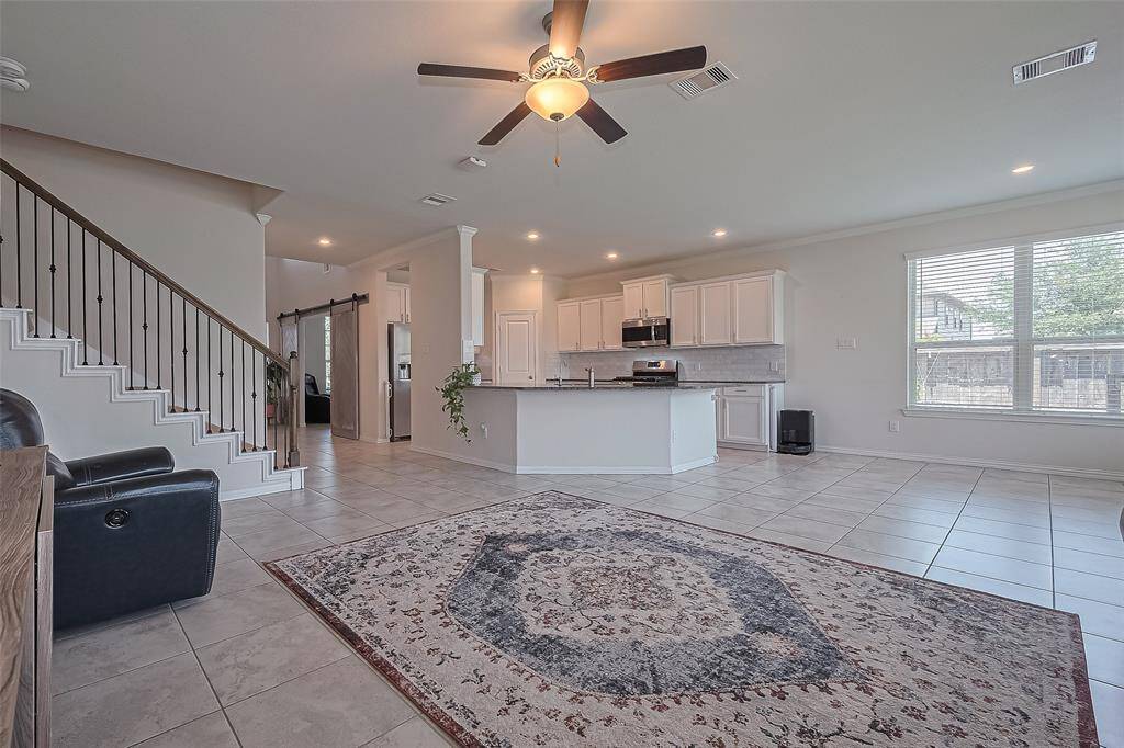 The gourmet kitchen overlooks the spacious family room, allowing you to stay engaged with guests or family while preparing meals