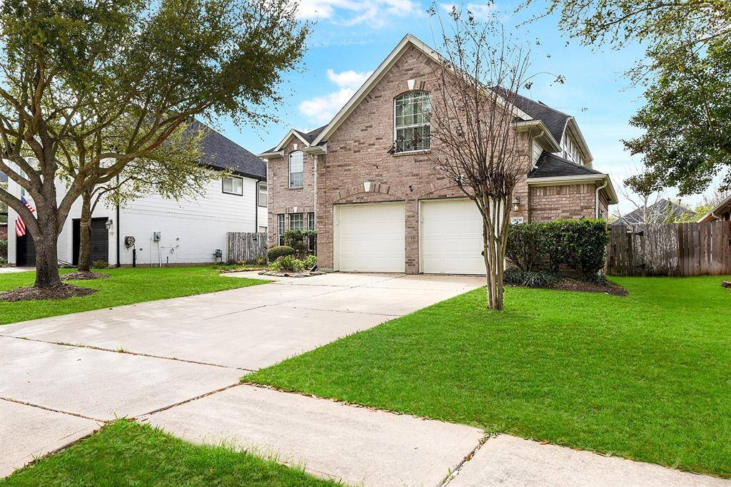 This home features a spacious double-car driveway, perfect for guest parking or enjoying playtime in the front yard. Additionally, the extra garage bump-out provides valuable storage space for bicycles, sports equipment, and hobbies, keeping everything organized and easily accessible.
