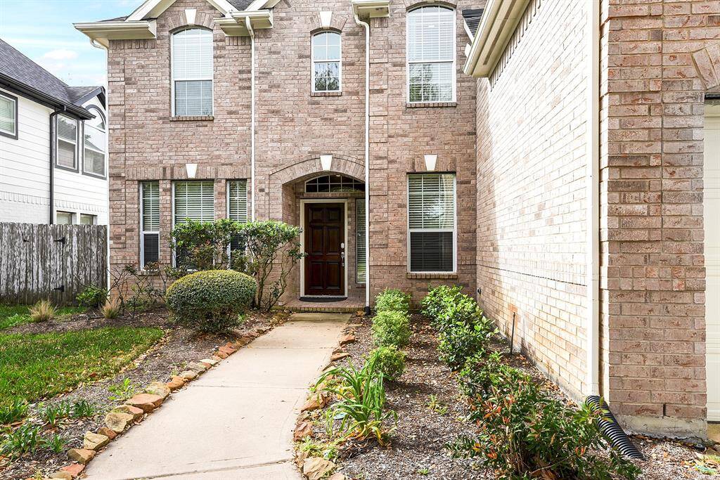 A charming sidewalk leads you to the covered front door, creating a welcoming entrance to this beautiful home. The all-brick exterior offers both durability and classic appeal, complemented by a full gutter system around the entire home and a sprinkler system for easy lawn maintenance.