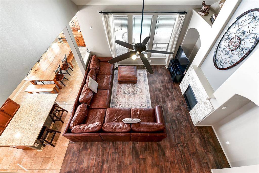 From upstairs, you can enjoy views overlooking the large living room, with clear sightlines into the kitchen and breakfast room. This open layout creates a spacious and connected feel, perfect for entertaining and family gatherings.