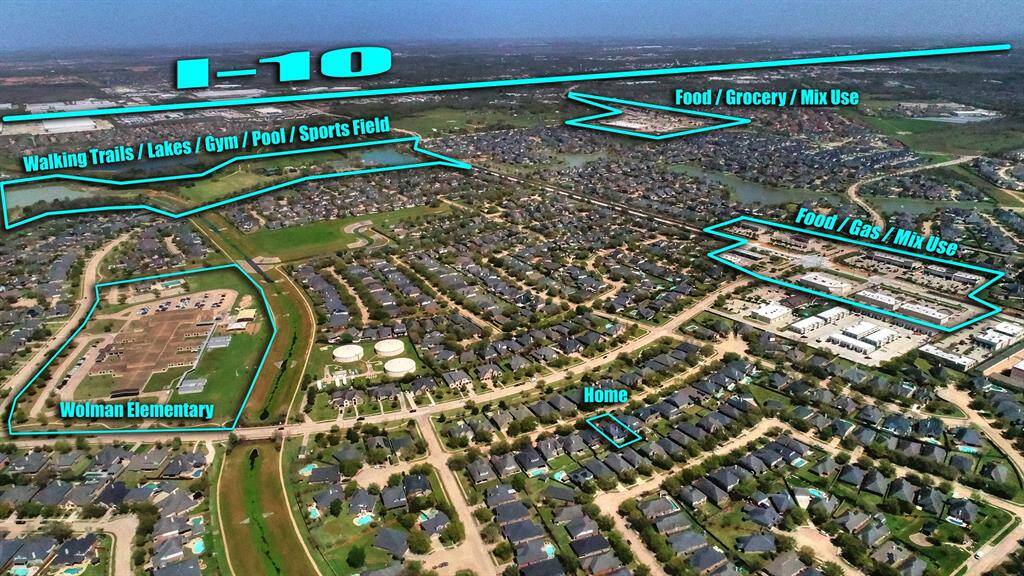An aerial view showcases the home’s proximity to the elementary school, neighborhood amenities, shopping centers, and easy access to I-10. This prime location offers convenience.