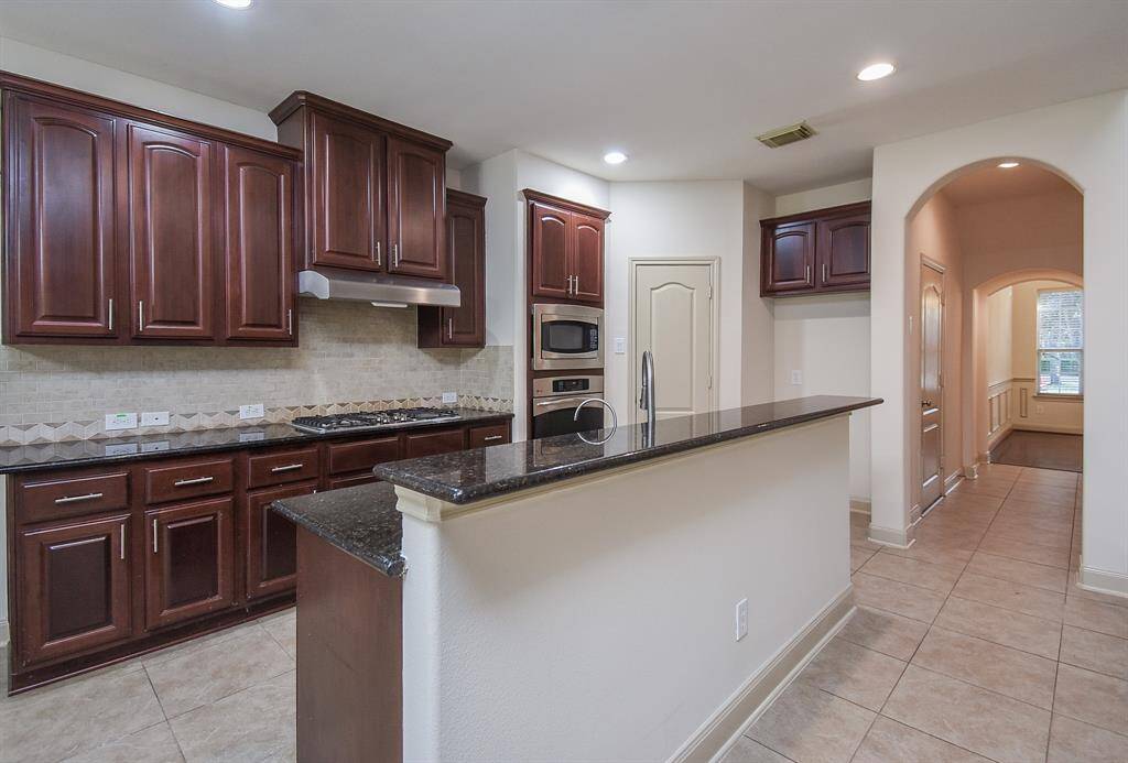 Custom cabinetry and walk-in pantry.