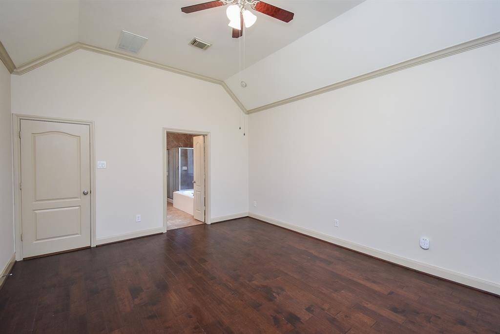 Another view of the primary bedroom.