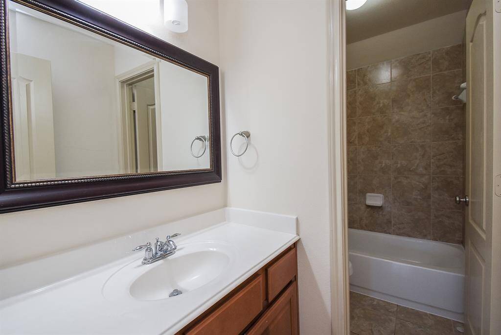 Upstairs secondary bathroom near Secondary bedroom (#3) and game room.