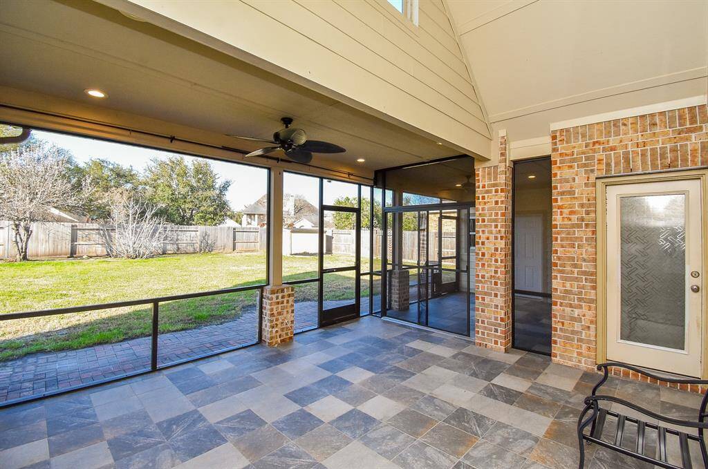 View of backyard from the screened-in patio.