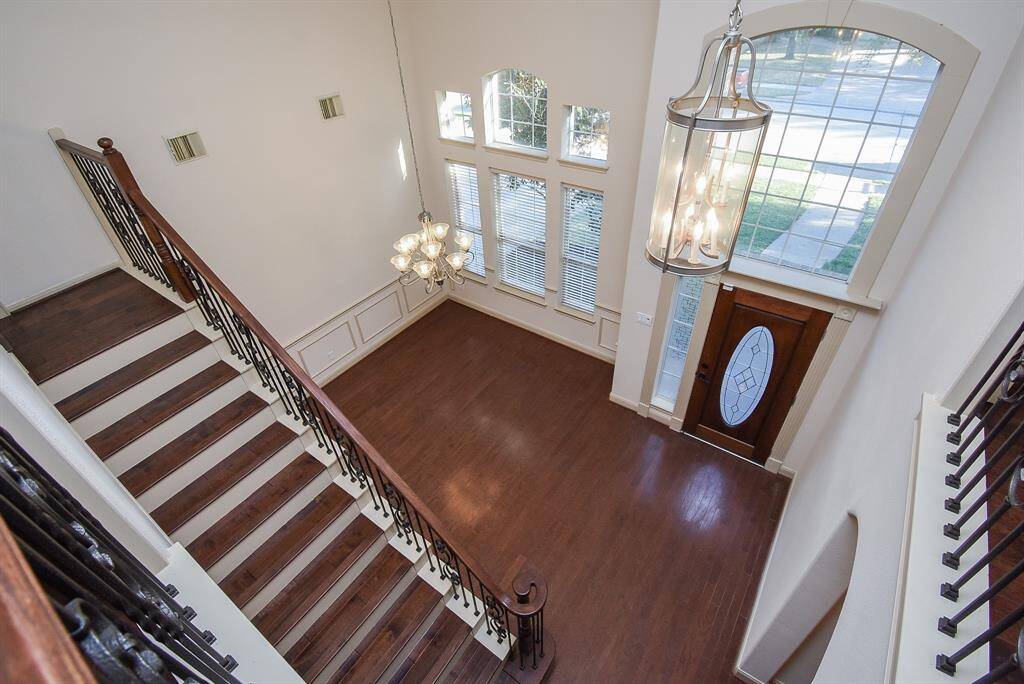 The elegant wood flooring and stylish chandeliers welcome your guests.