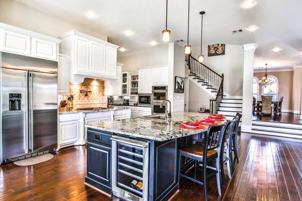 This fabulous kitchen has a massive island that serves as Breakfast Bar!
