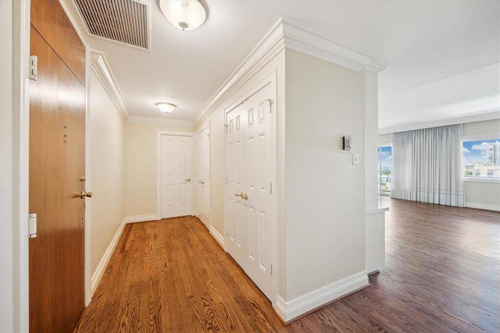 Entry Foyer with 2 storage closets. Door straight ahead leading to Kitchen.