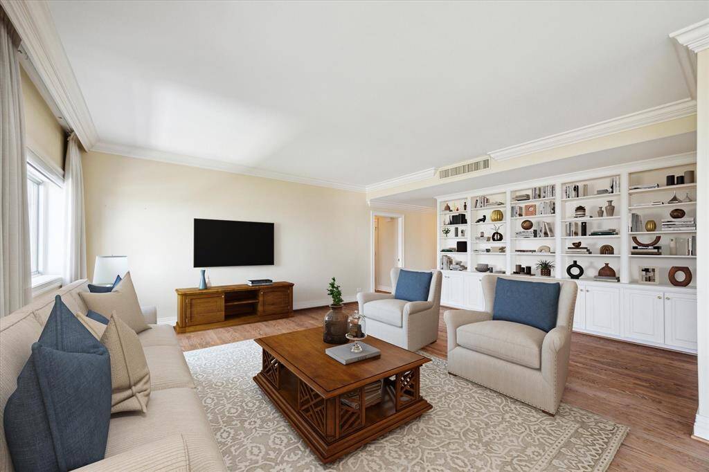 Living Room with Built-in Wall Unit and Window Treatments. Virtually Staged.