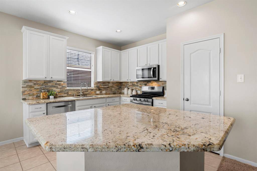 Large island is great for preparing meals and enjoying them!