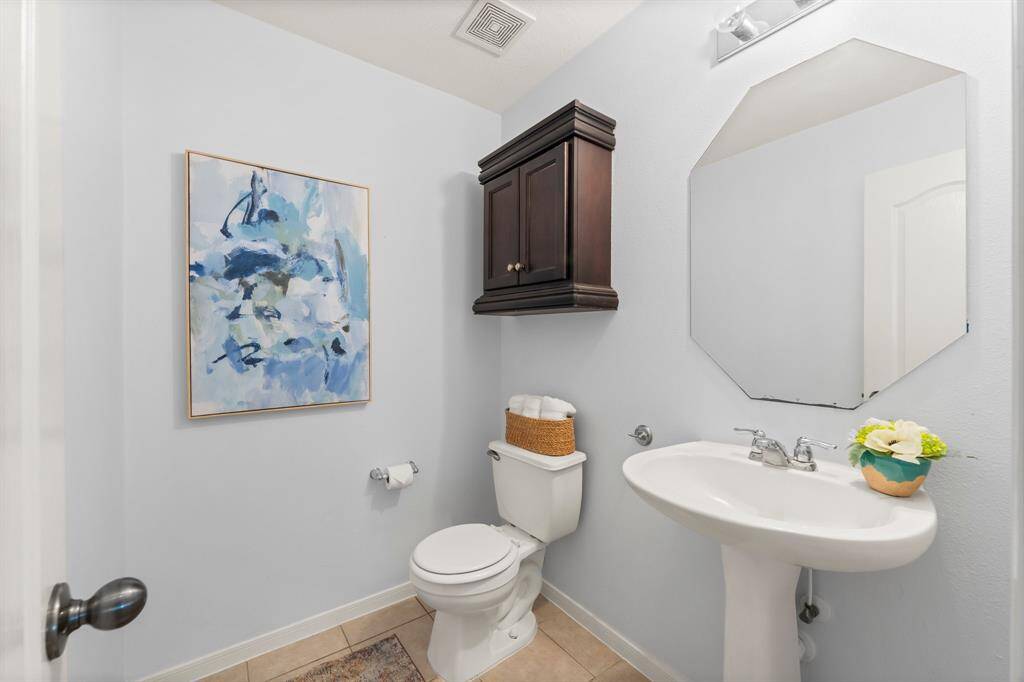 Powder room is conveniently located downstairs.