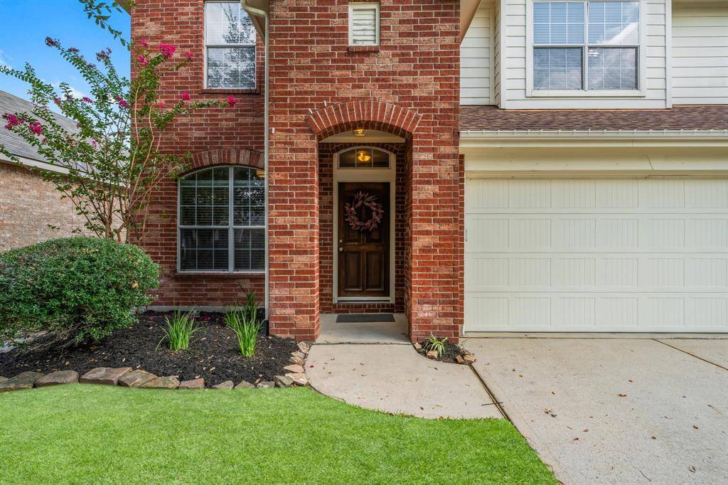 Handsome brick exterior and covered porch for greeting guests.