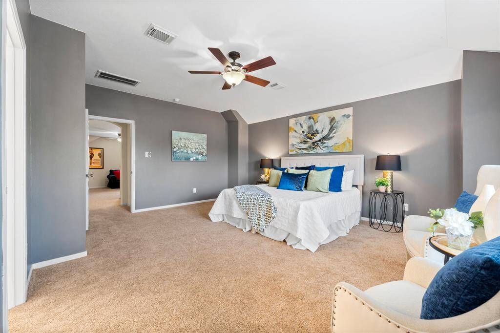 This primary bedroom is a true owner's retreat!