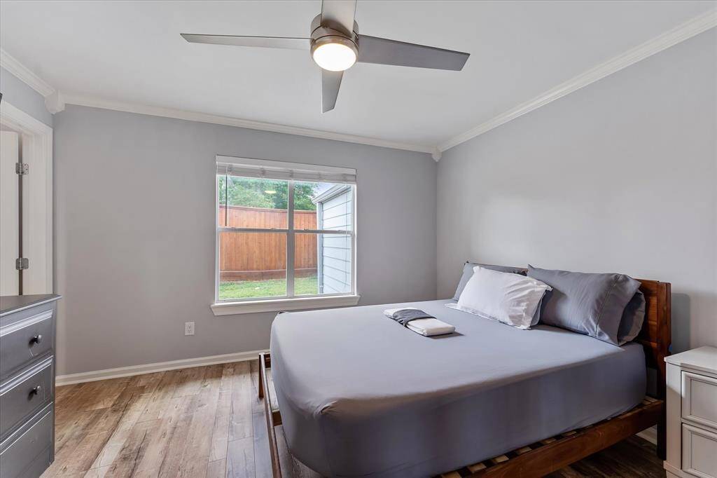 Just off the living area, this bright room features an en-suite bathroom with a walk-in shower — ideal as a guest suite, home office, or additional bedroom.