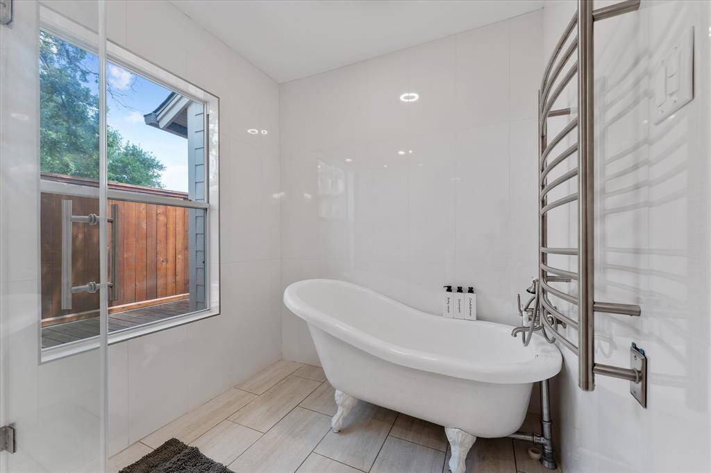 The clawfoot soaking tub exudes timeless charm — the perfect place to unwind at the end of a long day.