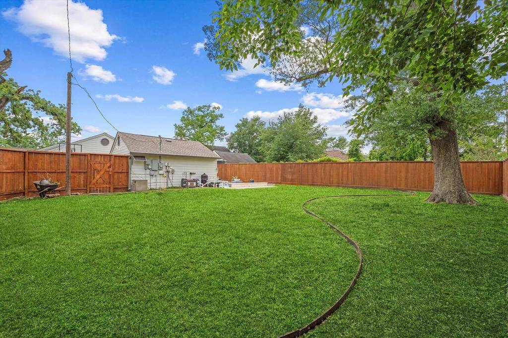 In addition to the pool, there’s ample space for a playground, pets, or open green space — all enclosed by a newly installed fence that’s been professionally stained and sealed.