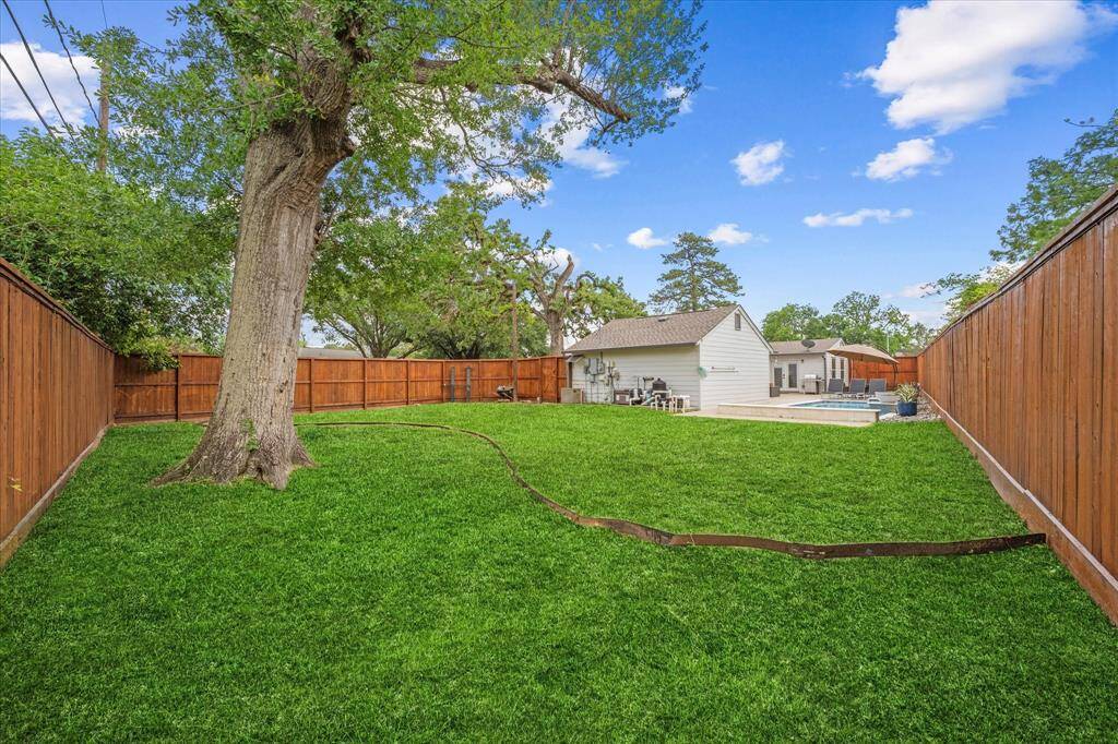 A final look at the backyard — designed for relaxation, play, and entertaining. Schedule your showing for 3003 Randall Street today!