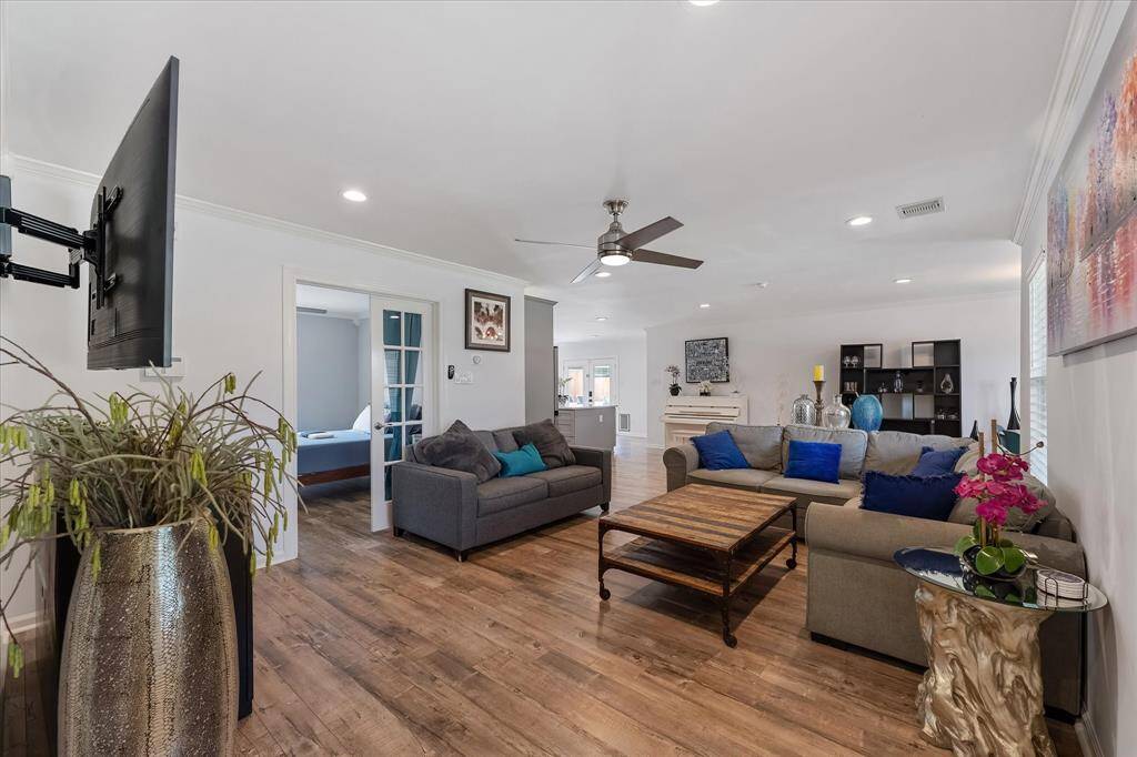 Bright and inviting, the living room sits at the heart of the home, opening effortlessly into the kitchen and dining area — a layout that makes everyday living feel connected and easy.