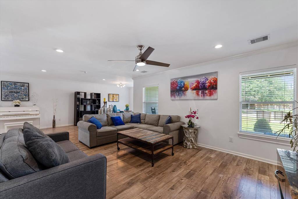 The spacious living room is perfect for hosting guests or enjoying cozy nights in, with plenty of room to gather, relax, and unwind.