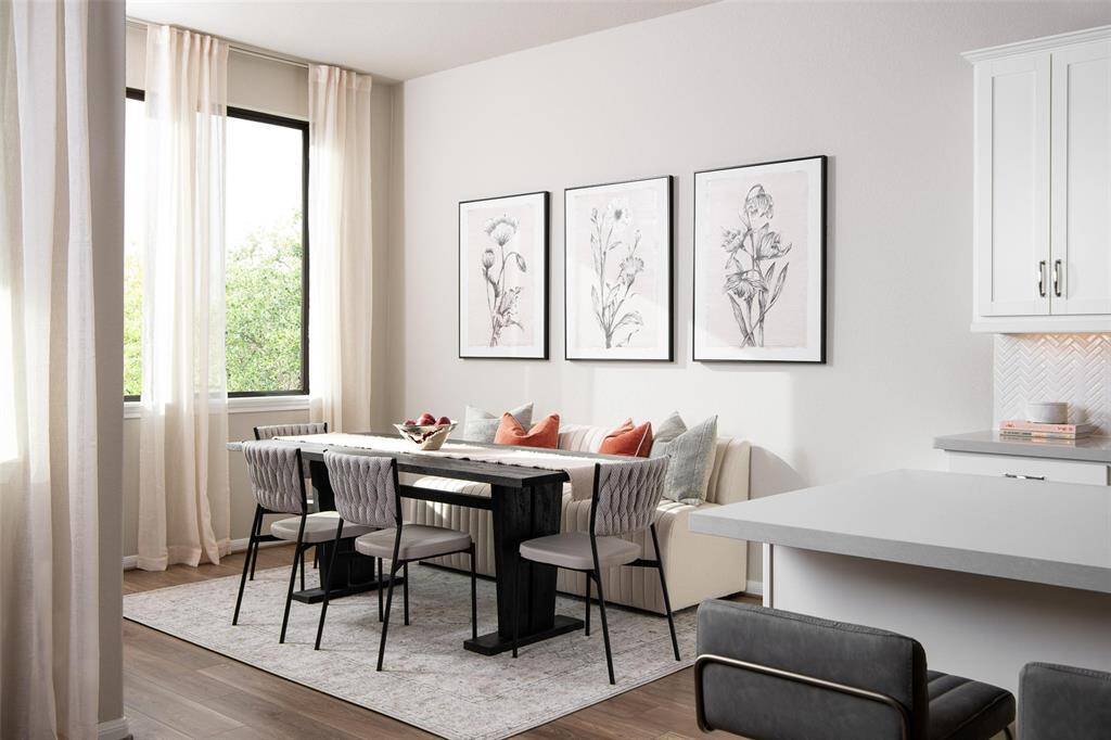 With an abundance of natural light streaming through the windows, the breakfast nook is bathed in a sunny glow, creating the perfect atmosphere to enjoy your morning coffee or a family breakfast.