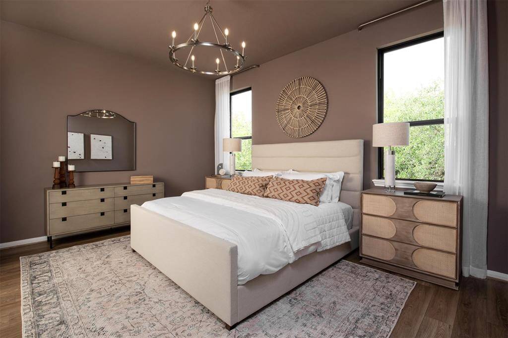 The primary bedroom is generously sized, creating a tranquil and spacious retreat that offers ample room for relaxation. Featuring plush carpet, high ceilings, fresh paint, and large windows that lets in natural lighting throughout the day.