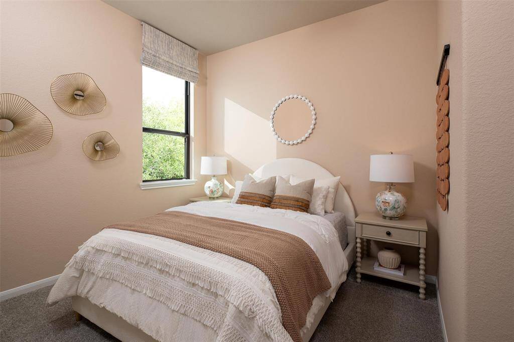Your secondary bedroom features plush carpet, fresh paint, closet, and a large window that lets in plenty of natural lighting.