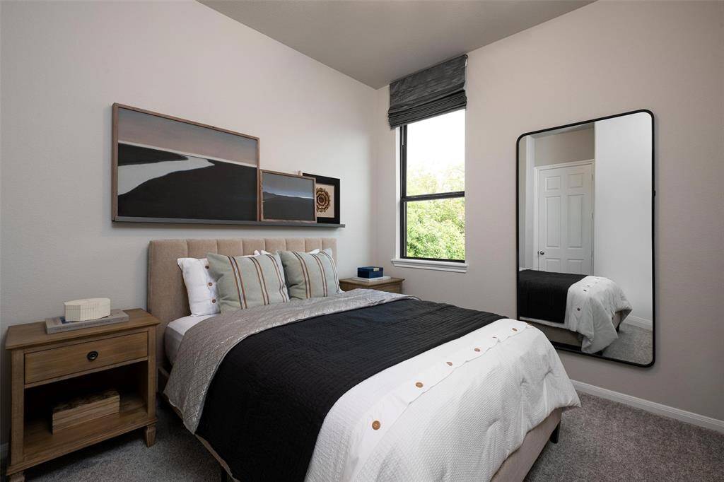 Your secondary bedroom features plush carpet, fresh paint, closet, and a large window that lets in plenty of natural lighting.