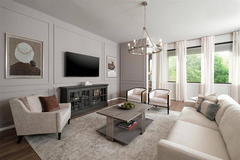 Your family room has ample space to entertain family and friends. This space features beautiful floors, fresh paint, ceiling fan with lighting, and high ceilings.