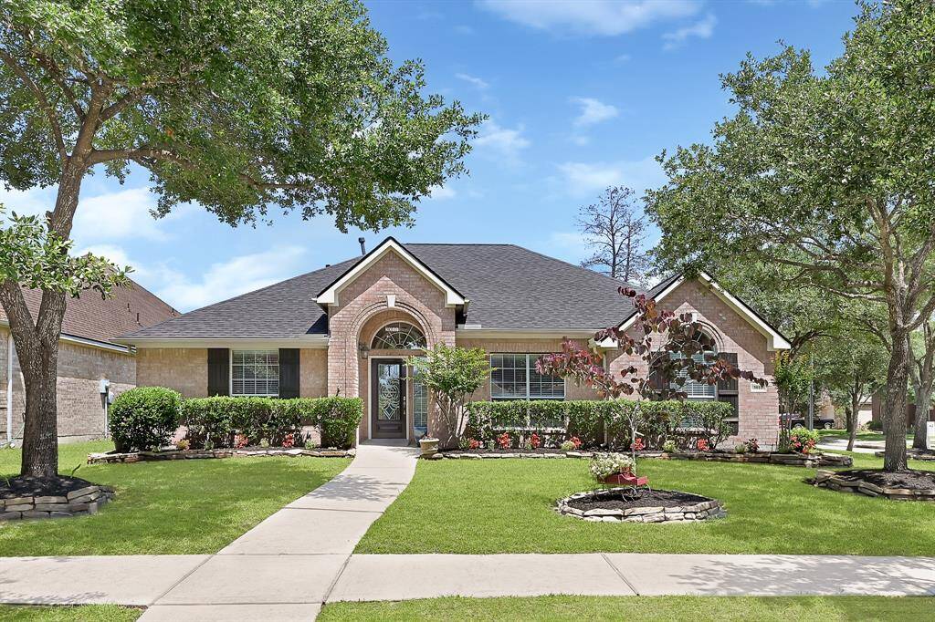 Welcome home to this beautiful one story corner lot, with mature trees and meticulously kept landscaping!