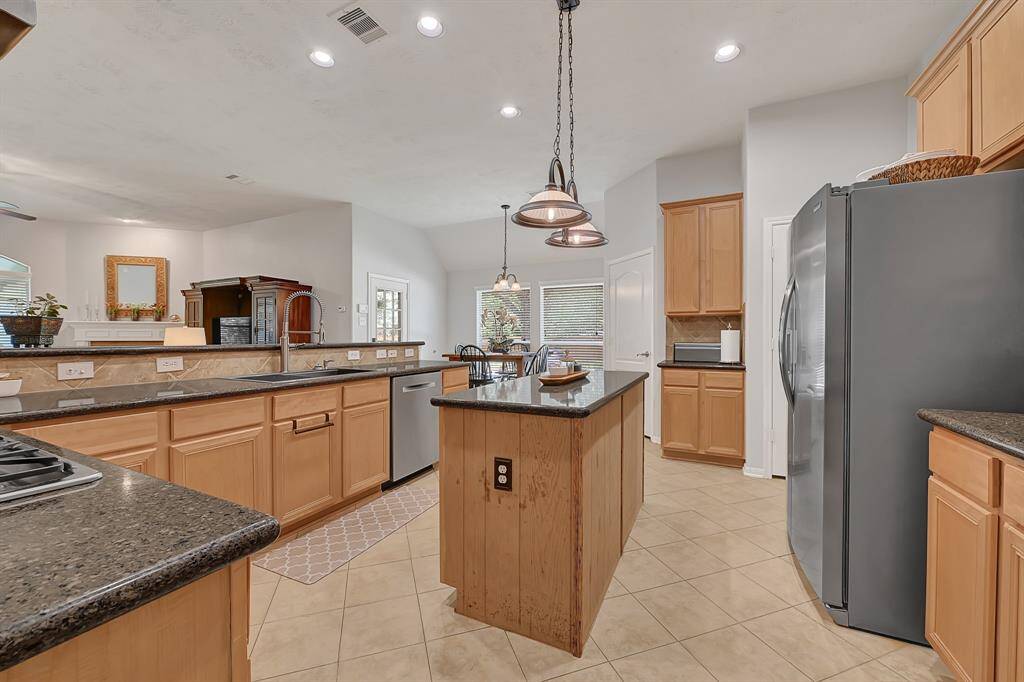 Beautiful and bright kitchen is also functional and equipped with a new kitchen sink, faucet and newer dishwasher.