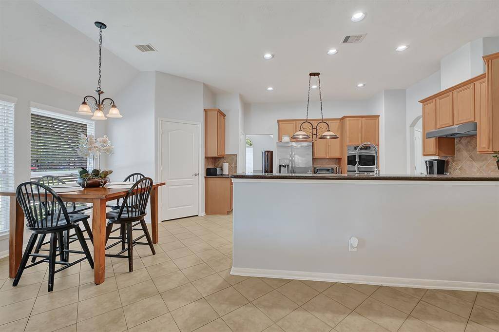 View of kitchen, breakfast and large utility room.
